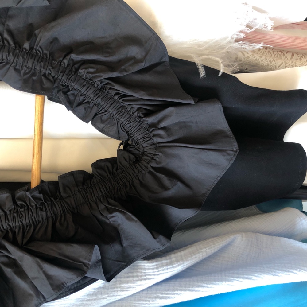 Black, right fit top with ruffles on top